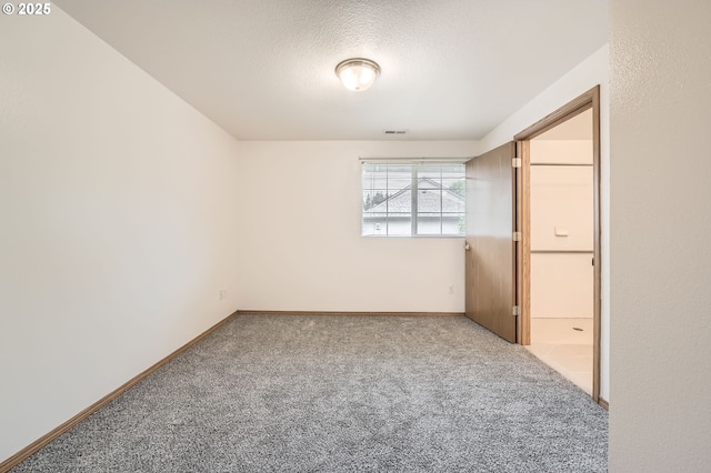 1006 NE 45th St, Vancouver, WA 98663 - unfurnished room with carpet floors, a textured ceiling, and baseboards