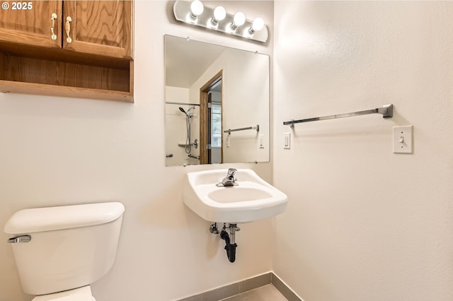 1006 NE 45th St, Vancouver, WA 98663 - bathroom featuring toilet, a sink, and a shower