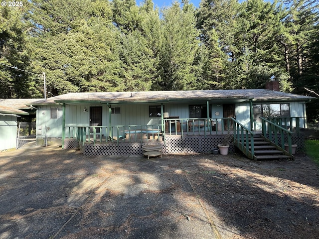 view of front of property featuring a porch and a chimney