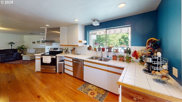 95169 Vista Loop, Gold Beach, OR 97444 - kitchen featuring appliances with stainless steel finishes, a sink, tile counters, white cabinets, and recessed lighting
