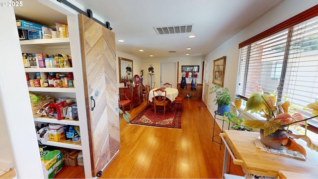 95169 Vista Loop, Gold Beach, OR 97444 - dining area featuring wood finished floors, a barn door, and recessed lighting
