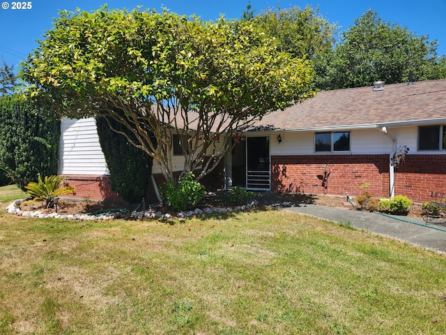 95169 Vista Loop, Gold Beach, OR 97444 - ranch-style house featuring brick siding, a front lawn, and a shingled roof