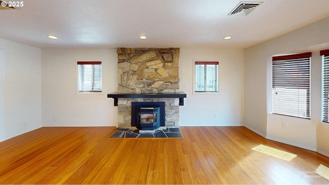 95169 Vista Loop, Gold Beach, OR 97444 - unfurnished living room featuring healthy amount of natural light, wood finished floors, baseboards, and recessed lighting