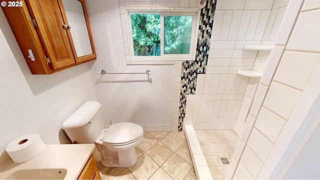 95169 Vista Loop, Gold Beach, OR 97444 - bathroom featuring a stall shower, toilet, vanity, and tile patterned floors