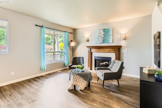 1219 34th Pl, Forest Grove, OR 97116 - sitting room featuring a tile fireplace and wood finished floors