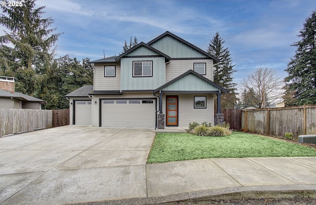 view of front of property with a garage and a front yard