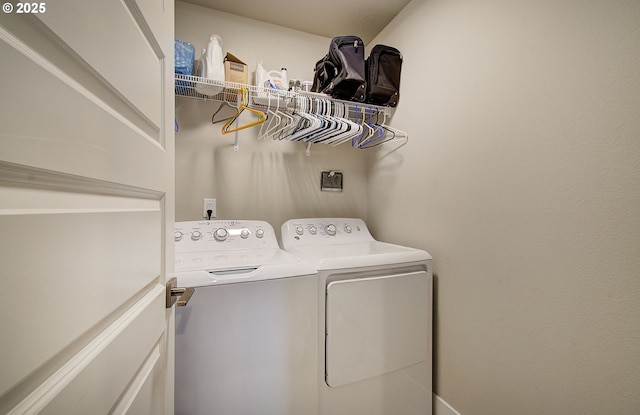 clothes washing area with washer and dryer