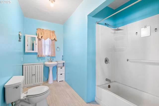 full bathroom featuring a sink, toilet, and shower / bathtub combination