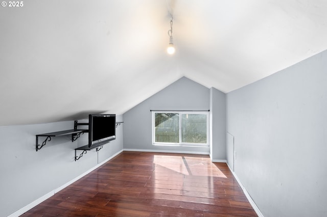 bonus room with lofted ceiling, baseboards, and hardwood / wood-style floors