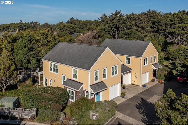 drone / aerial view with a view of trees