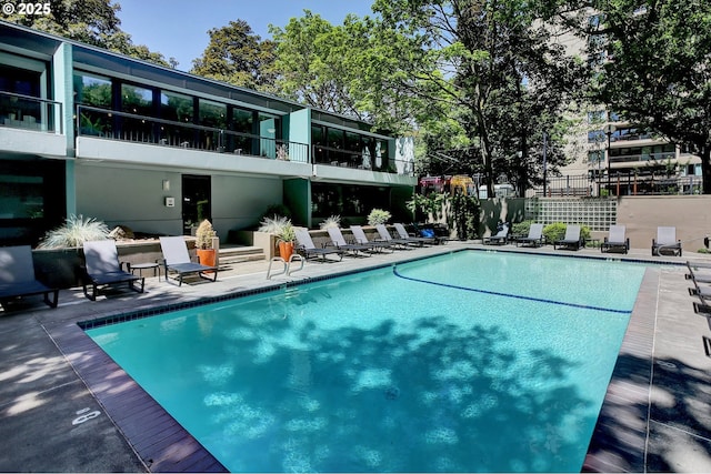 view of swimming pool featuring a patio