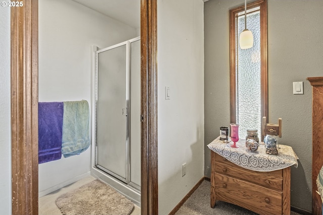 bathroom featuring an enclosed shower