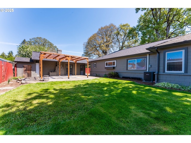 rear view of house featuring fence, a pergola, cooling unit, a lawn, and a patio