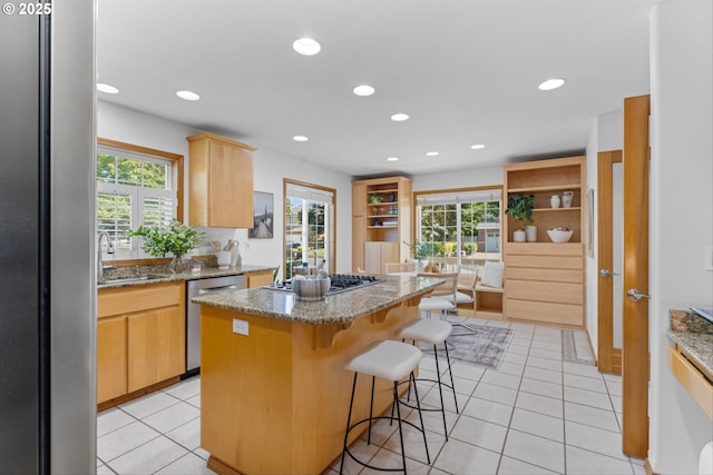 1281 NE Zachary St, Hillsboro, OR 97124 - kitchen featuring appliances with stainless steel finishes, a sink, a kitchen island, plenty of natural light, and recessed lighting