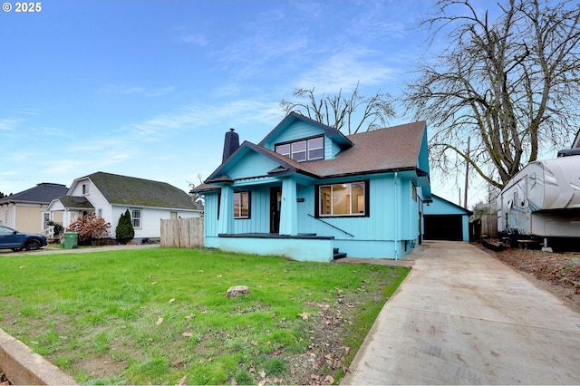 311 N 9th St, Cottage Grove, OR 97424 - bungalow-style home with a chimney, a garage, an outbuilding, and board and batten siding