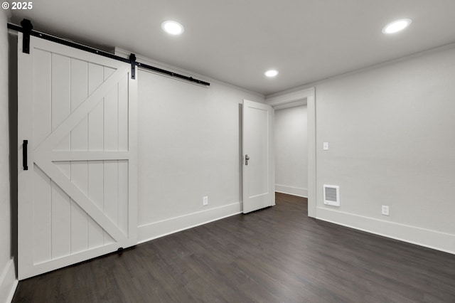 311 N 9th St, Cottage Grove, OR 97424 - below grade area featuring a barn door, dark wood-style flooring, and recessed lighting
