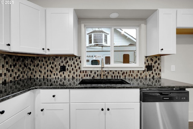 311 N 9th St, Cottage Grove, OR 97424 - kitchen featuring stainless steel dishwasher, a sink, white cabinetry, and backsplash