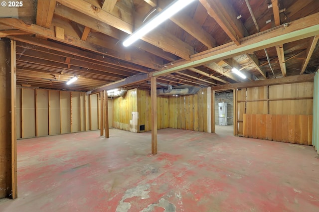 unfinished basement with water heater