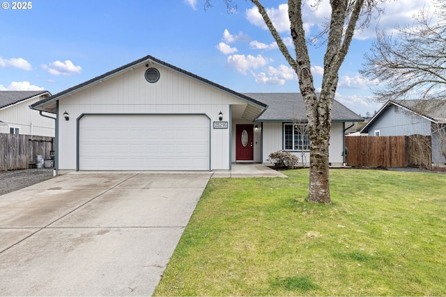 single story home with driveway, roof with shingles, an attached garage, fence, and a front lawn