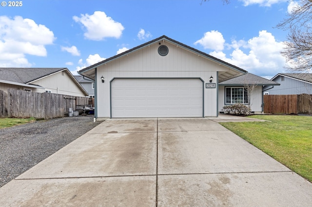 ranch-style home featuring driveway, a front lawn, an attached garage, and fence