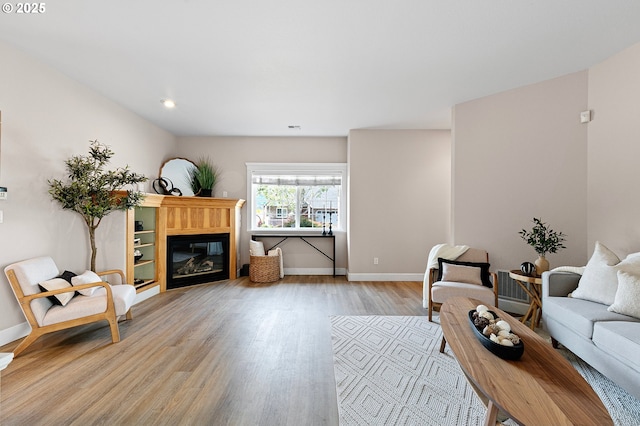 3301 Parker Ln, Springfield, OR 97477 - living area with wood finished floors, a glass covered fireplace, and recessed lighting