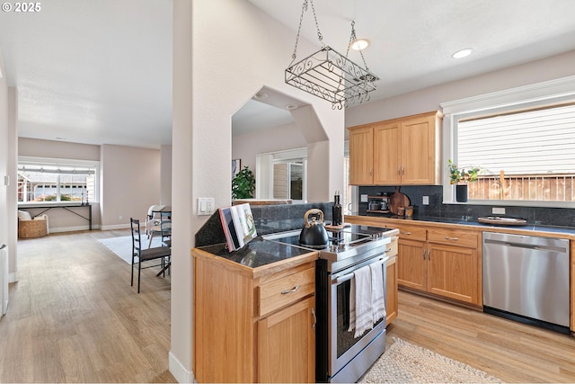 3301 Parker Ln, Springfield, OR 97477 - kitchen with appliances with stainless steel finishes, light wood-type flooring, tile countertops, backsplash, and light brown cabinets