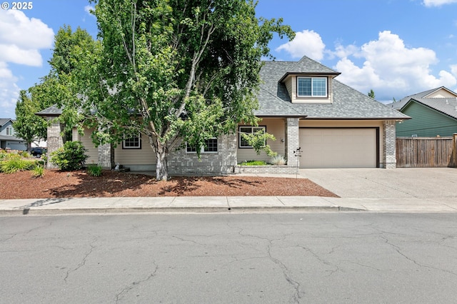 3301 Parker Ln, Springfield, OR 97477 - obstructed view of property featuring a garage, brick siding, driveway, and roof with shingles