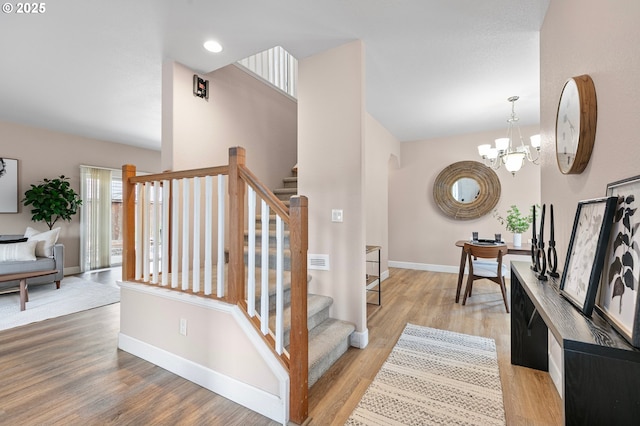 3301 Parker Ln, Springfield, OR 97477 - stairway featuring a chandelier and wood finished floors
