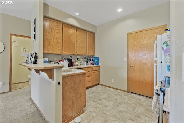 4118/4120 S E St, Springfield, OR 97478 - kitchen with stove, a peninsula, light countertops, a breakfast bar, and recessed lighting