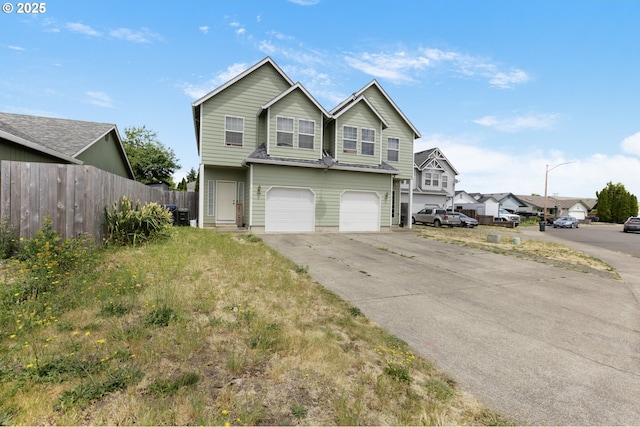 4118/4120 S E St, Springfield, OR 97478 - traditional home featuring a garage, concrete driveway, and a residential view