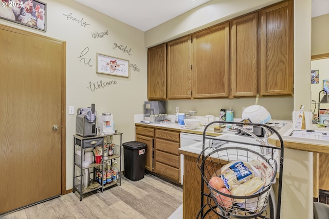 4118/4120 S E St, Springfield, OR 97478 - kitchen with light wood finished floors, light countertops, and brown cabinetry