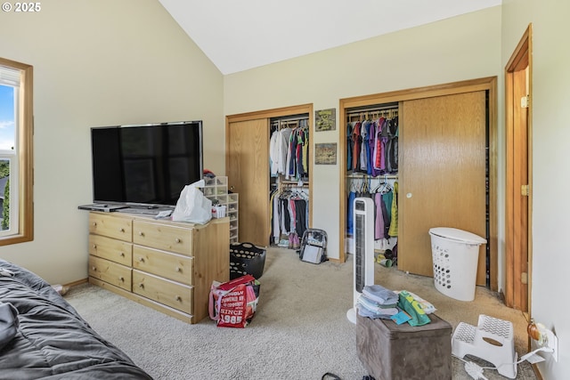 4118/4120 S E St, Springfield, OR 97478 - bedroom featuring two closets, vaulted ceiling, and carpet