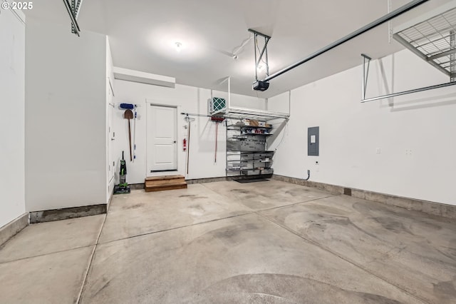 garage featuring a garage door opener and electric panel