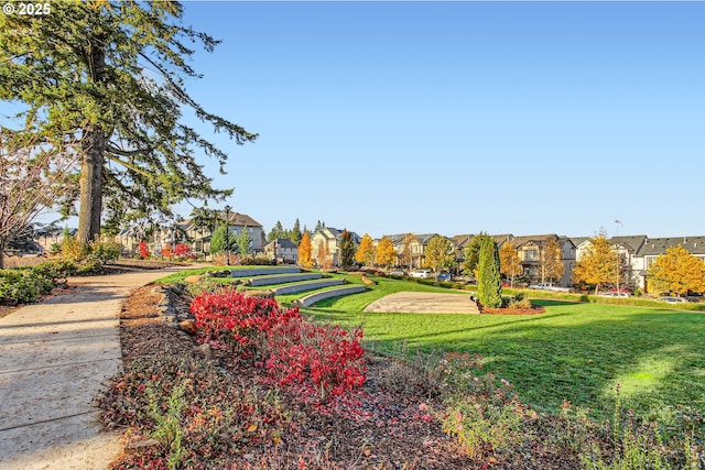 surrounding community featuring a residential view and a yard