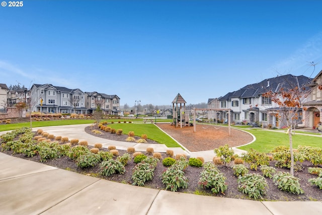 view of property's community with a residential view and a lawn