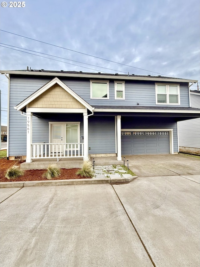 view of front of house with a porch and a garage