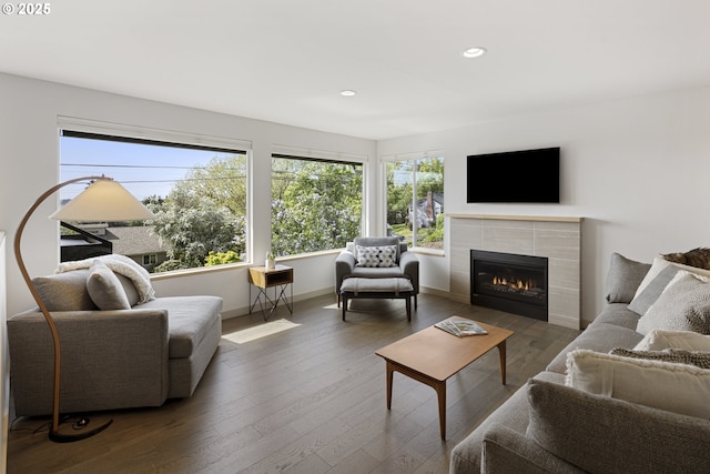 8630 SW 61st Ave, Portland, OR 97219 - living area featuring recessed lighting, wood finished floors, a tiled fireplace, and baseboards