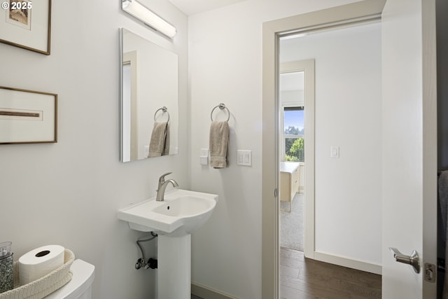8630 SW 61st Ave, Portland, OR 97219 - half bathroom featuring wood finished floors, baseboards, and toilet
