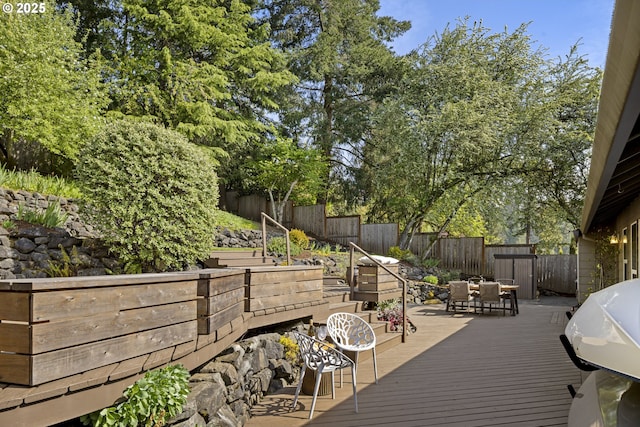 8630 SW 61st Ave, Portland, OR 97219 - wooden deck featuring outdoor dining space, a fenced backyard, and area for grilling