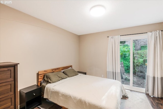 6926 SE Deardorff Rd, Portland, OR 97236 - bedroom with dark wood-style flooring and access to exterior