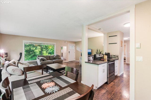 6926 SE Deardorff Rd, Portland, OR 97236 - dining space featuring dark wood-type flooring and baseboards