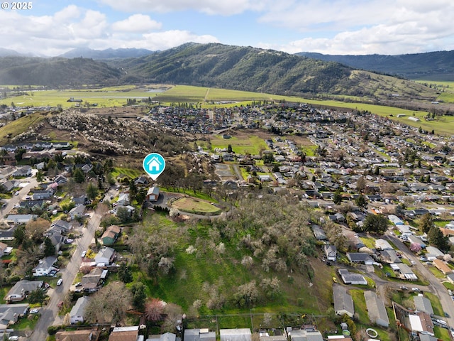 bird's eye view featuring a residential view and a mountain view