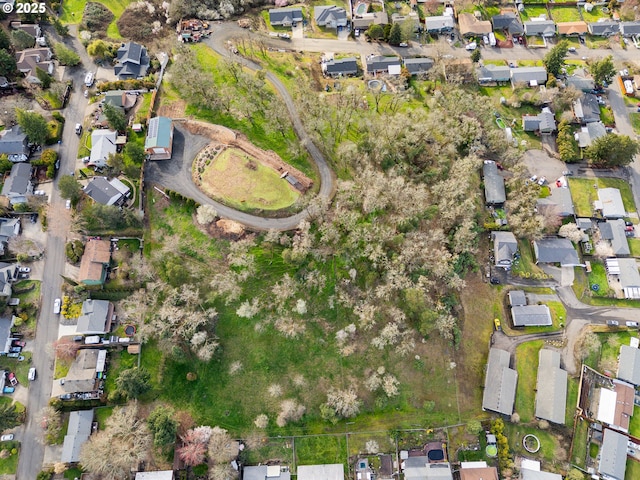 birds eye view of property with a residential view