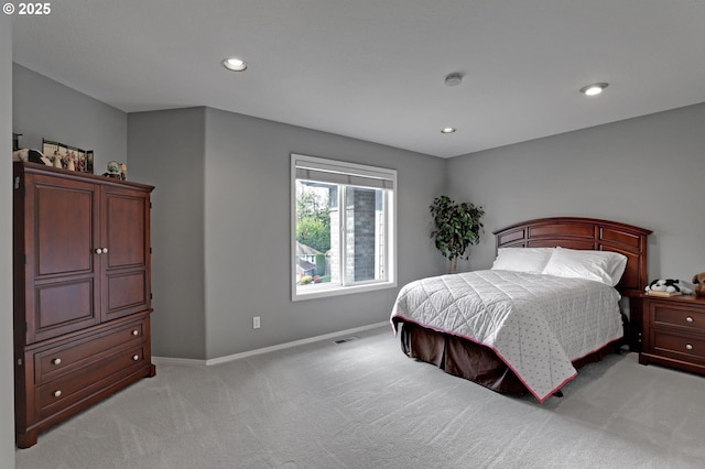 bedroom with light carpet, baseboards, and recessed lighting