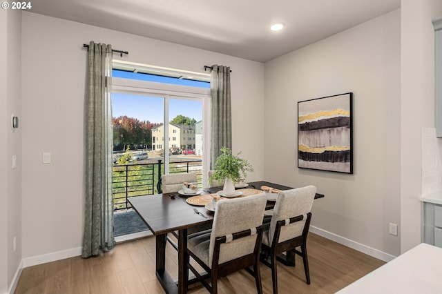 dining room with hardwood / wood-style flooring