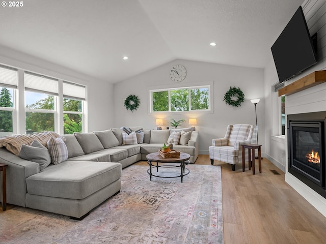 3595 Balm St S, Salem, OR 97302 - living area featuring light wood finished floors, a glass covered fireplace, lofted ceiling, and recessed lighting
