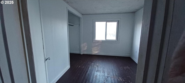252 5th St, Glendale, OR 97442 - unfurnished bedroom with dark wood-type flooring, baseboards, and a textured ceiling