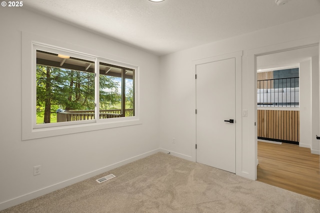 17349 Banyan Ln, Lake Oswego, OR 97034 - carpeted spare room featuring baseboards and a textured ceiling