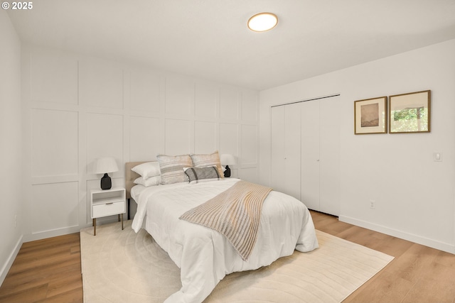 17349 Banyan Ln, Lake Oswego, OR 97034 - bedroom with light wood-style flooring, baseboards, and a closet