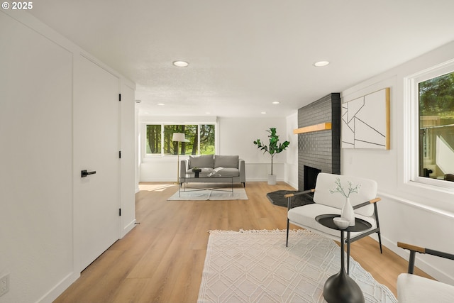 17349 Banyan Ln, Lake Oswego, OR 97034 - living area featuring light wood-style flooring, baseboards, a fireplace, and recessed lighting